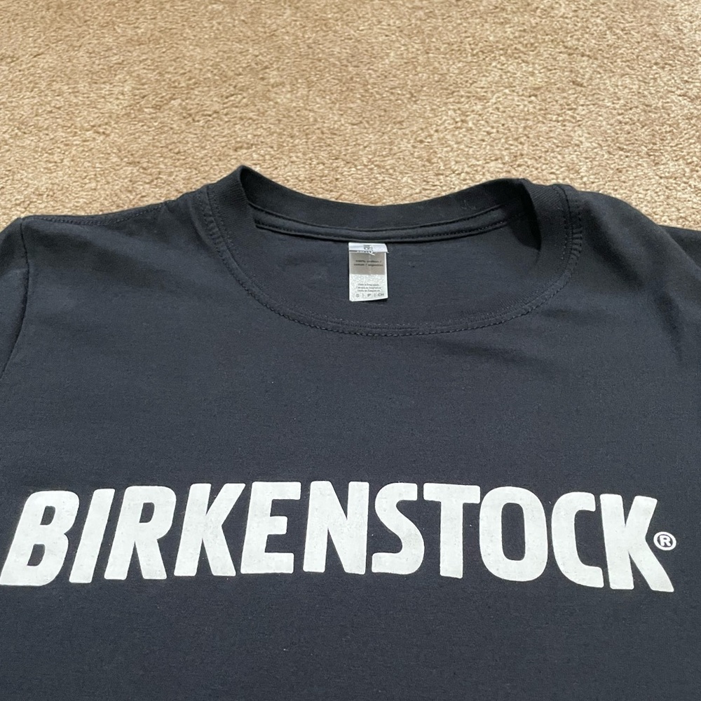 BIRKENSTOCK T-SHIRT SIZE SMALL BLACK W/ WHITE CHEST & SLEEVE LOGO STAFF ITEM?